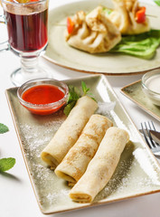 stuffed pancakes with sauce
