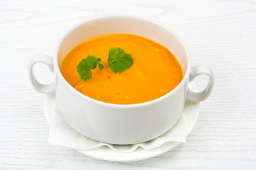 Cream soup of carrots, pumpkins, vegetables in white soup