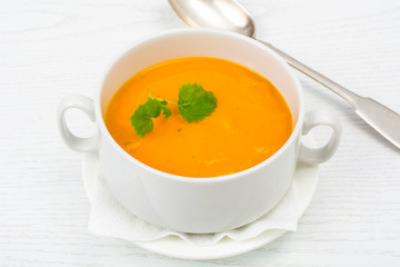 Cream soup of carrots, pumpkins, vegetables in white soup