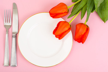 White plate, bouquet, bright pastel background