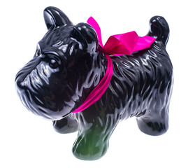 Black dog statuette isolated on white background