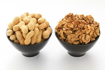 Walnuts & peanuts isolated on white background. 