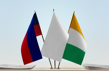 Flags of Liechtenstein and Ivory Coast with a white flag in the middle