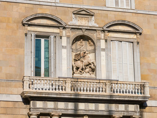 Saint George with dragon sculpture. Balcony of the Generalitat Palace of Catalonia in Barcelona, Spain.