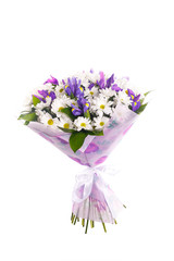 Bouquet of flowers from white chrysanthemums, chamomiles and violet irises, russus, lilac package, white ribbon. Color, contrast. A holiday, a gift for a woman. Smart. Side view. Isolated