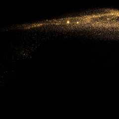 Gold glitter texture isolated on black background. Amber particles color. Celebratory background concept.