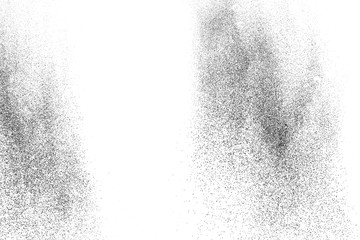 Black powder explosion against white background.The particles of charcoal splatted on white...