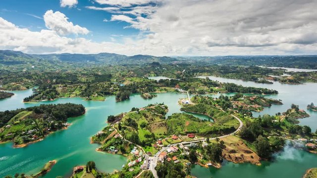 Medellin, Colombia, time lapse view of Guatape from the Rock (La Piedra del Penol) during daytime. Zoom out.