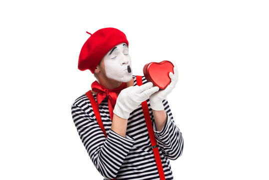 mime kissing heart shaped gift box isolated on white, st valentines day concept