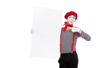 mime pointing on empty board isolated on white