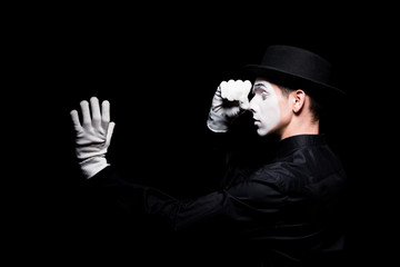 mime pretending looking in spyglass isolated on black
