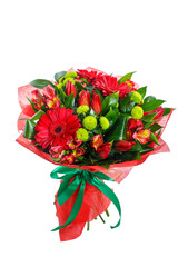 Bouquet of gerberas, tulips, bush chrysanthemums, Ruscus, alstroemeria, aspidistra. In red packing with green ribbon. A holiday, a gift for a woman. Big and smart. Side view. Isolated