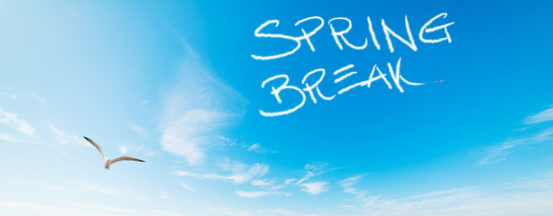 Spring break written in the blue sky
