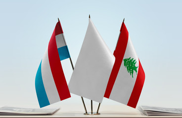 Flags of Netherlands and Lebanon with a white flag in the middle