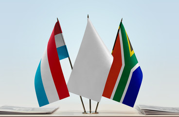 Flags of Netherlands and Republic of South Africa with a white flag in the middle
