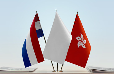 Flags of Netherlands and Hong Kong with a white flag in the middle