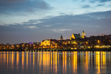 Night view on the old town and Vistula river in Warsaw, Poland
