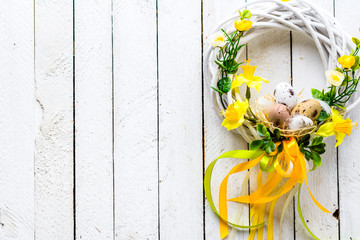 Easter background with spring wreath hanging on door