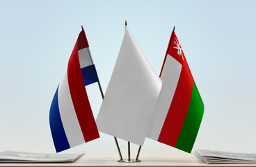 Flags of Netherlands and Oman with a white flag in the middle