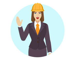 Businesswoman in construction helmet greeting someone with his hand raised up