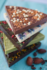 triangle slices of chocolate on wooden surface