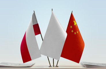 Flags of Poland and China with a white flag in the middle
