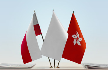 Flags of Poland and Hong Kong with a white flag in the middle