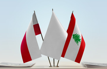 Flags of Poland and Lebanon with a white flag in the middle