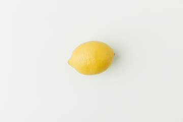 Ripe yellow lemon isolated on white background