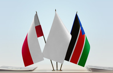 Flags of Poland and South Sudan with a white flag in the middle