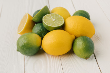Juicy citruses on white wooden background