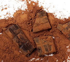 Chocolate bars with cocoa powder isolated on white background, top view