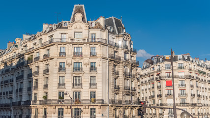 Fototapeta na wymiar Paris, typical facade in a charming district, beautiful building 