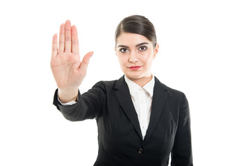 Portrait of beautiful female flight attendant showing stop gesture