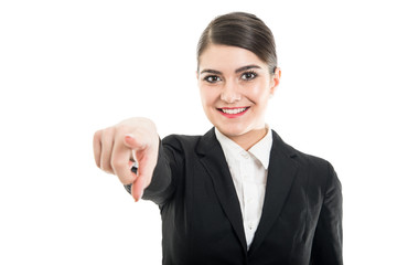 Portrait of beautiful female flight attendant pointing camera