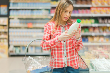 Woman buying dairy products.