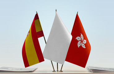 Flags of Spain and Hong Kong with a white flag in the middle