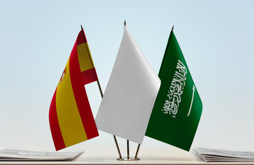Flags of Spain and Saudi Arabia with a white flag in the middle