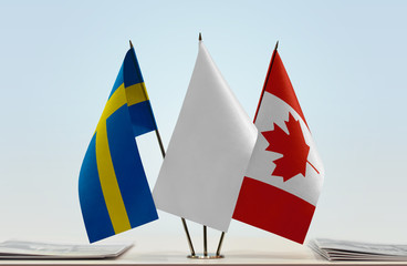 Flags of Sweden and Canada with a white flag in the middle © Oleksandr
