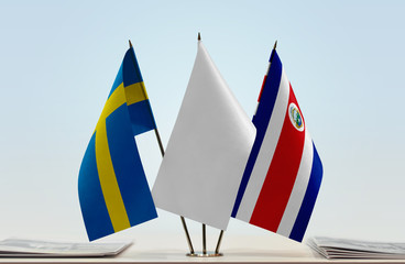 Flags of Sweden and Costa Rica with a white flag in the middle