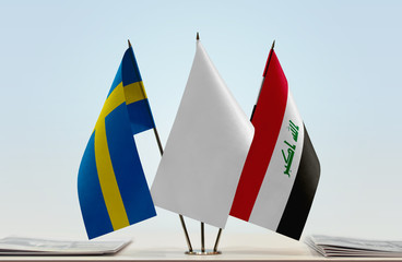 Flags of Sweden and Iraq with a white flag in the middle