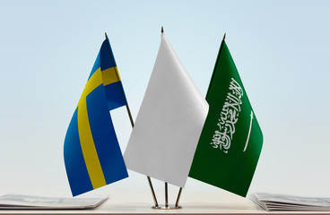 Flags of Sweden and Saudi Arabia with a white flag in the middle