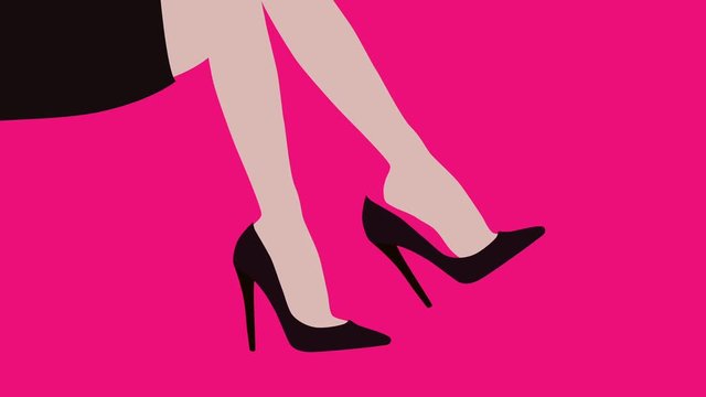 woman dangling high heel shoe from her foot