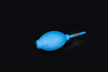 Blue Rubber Blower for cleaning the camera on a black background.