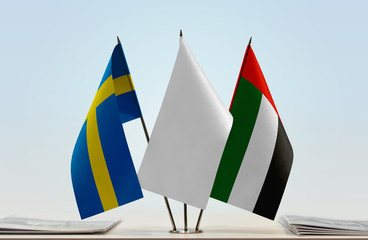 Flags of Sweden and UAE with a white flag in the middle