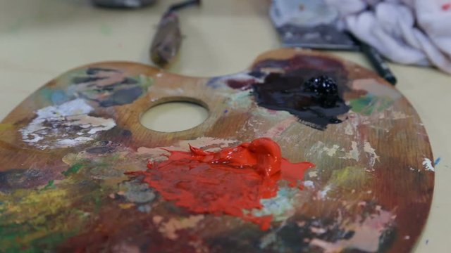 Artist Painting - Painter Takes The Black Color With The Brush From The Palette