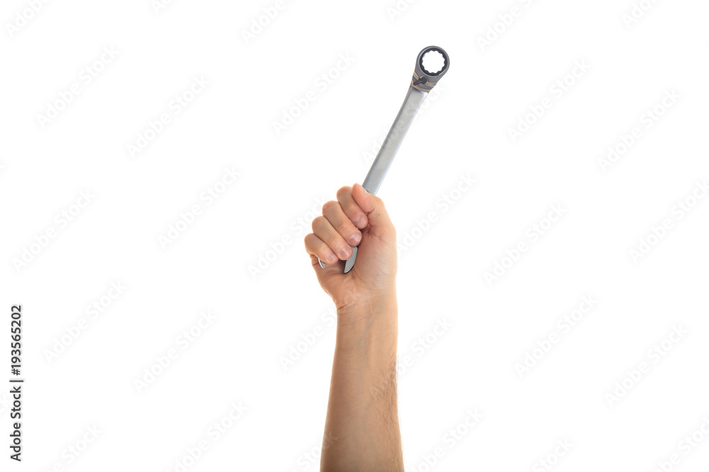 Poster Hand holding a metal spanner on white background