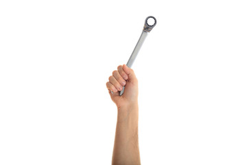 Hand holding a metal spanner on white background