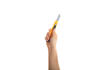 Hand with a paper cutter on white background