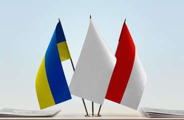 Flags of Ukraine and Indonesia with a white flag in the middle